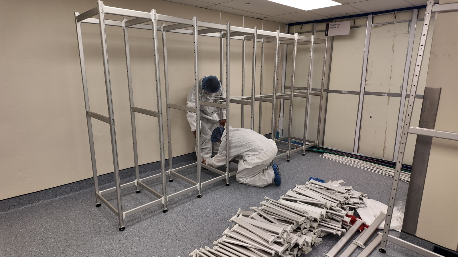Installer assembling storage frames