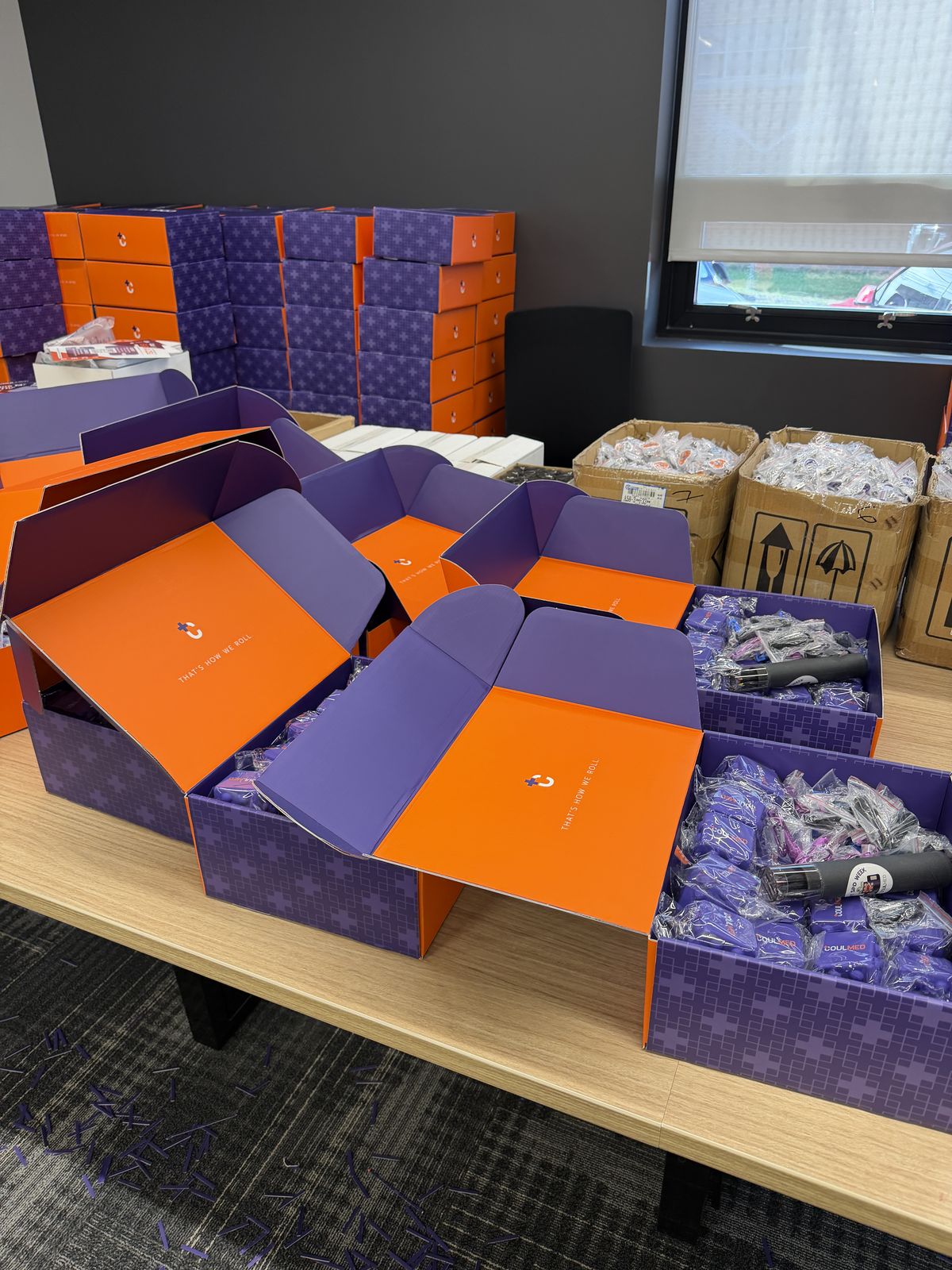 Boxes open on a table during packing